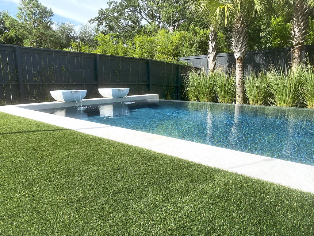 Backyard poolscape featuring ForeverLawn synthetic grass Port O’connor, TX